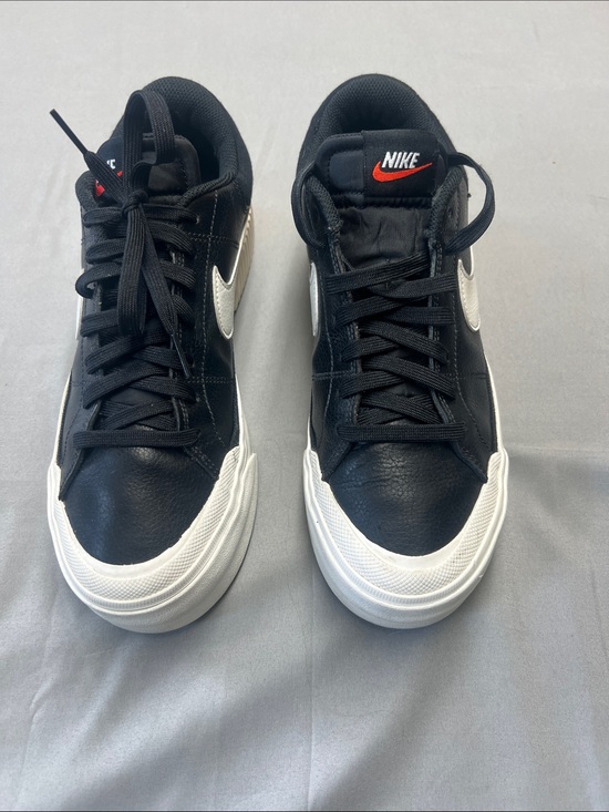Nike Shoes - Nike Black Leather Low-Top Sneakers with White Sole and Silver Swoosh